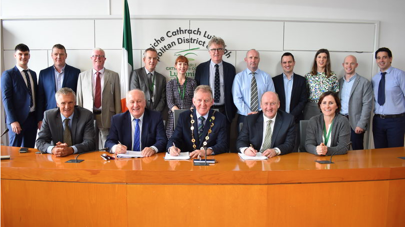 Glenman Corporation director Albert Conneally (front row second left) pictured with Mayor of Limerick Michael Sheahan at the signing of contracts.